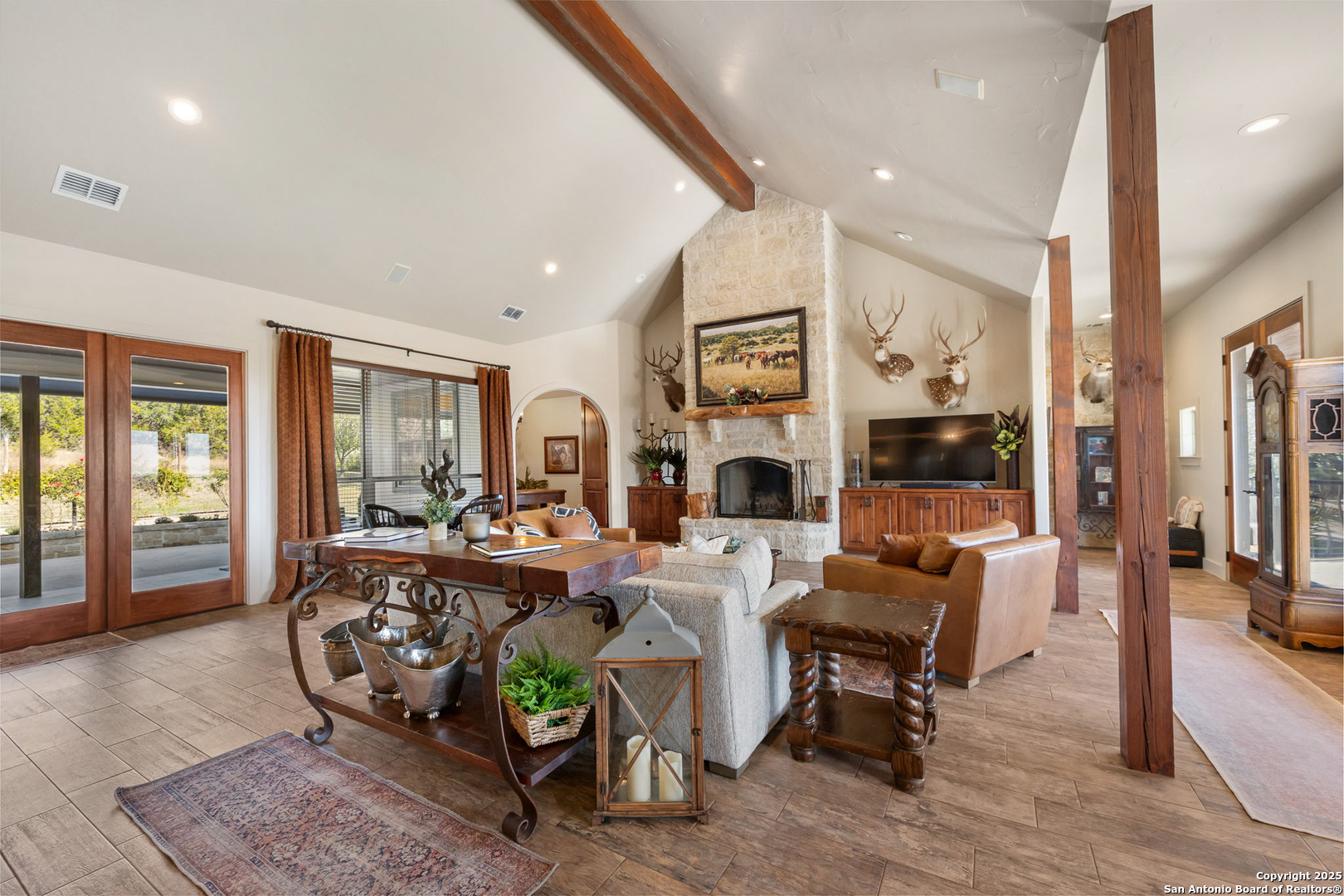 115 Spanish Pass Road Boerne, TX 78006 - Photo 10 of 50 a living room with fireplace furniture and a large window