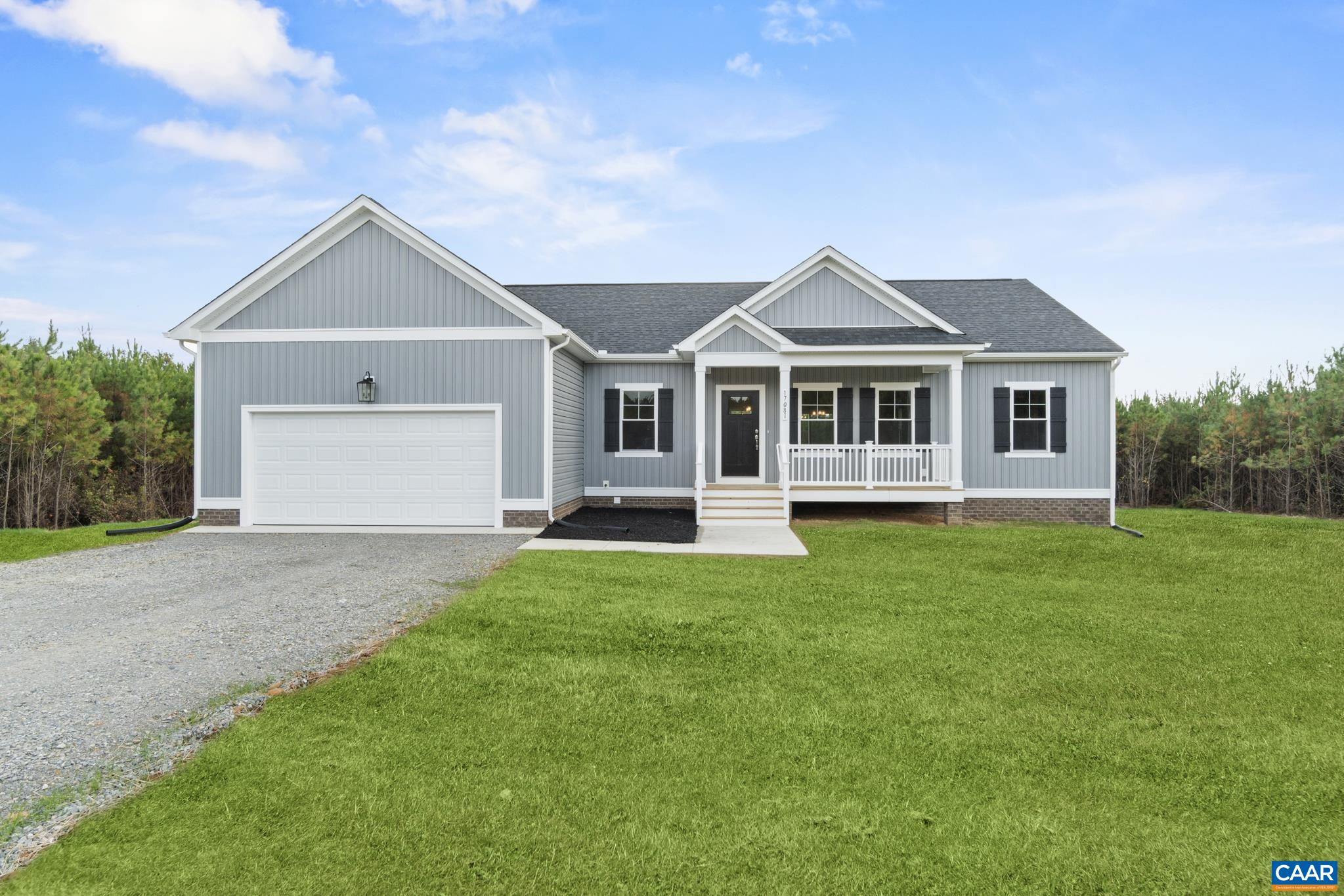 Lot 4 Hells Bend Road Palmyra, VA 22963 - Photo 1 of 21 a front view of a house with a yard and trees
