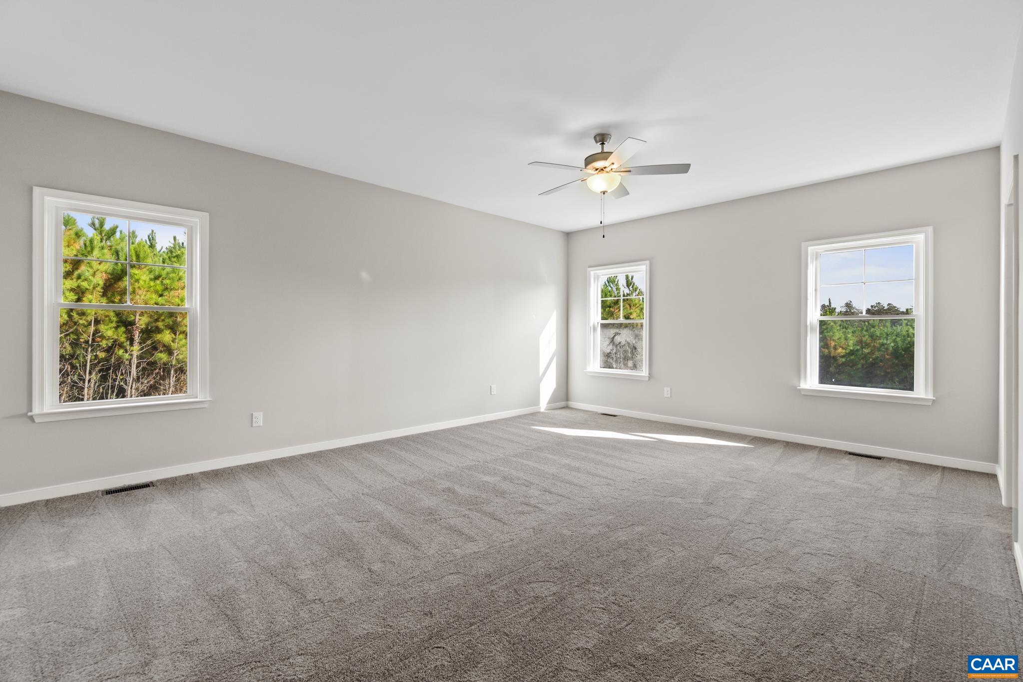 Lot 4 Hells Bend Road Palmyra, VA 22963 - Photo 11 of 21 an empty room with windows and chandelier fan
