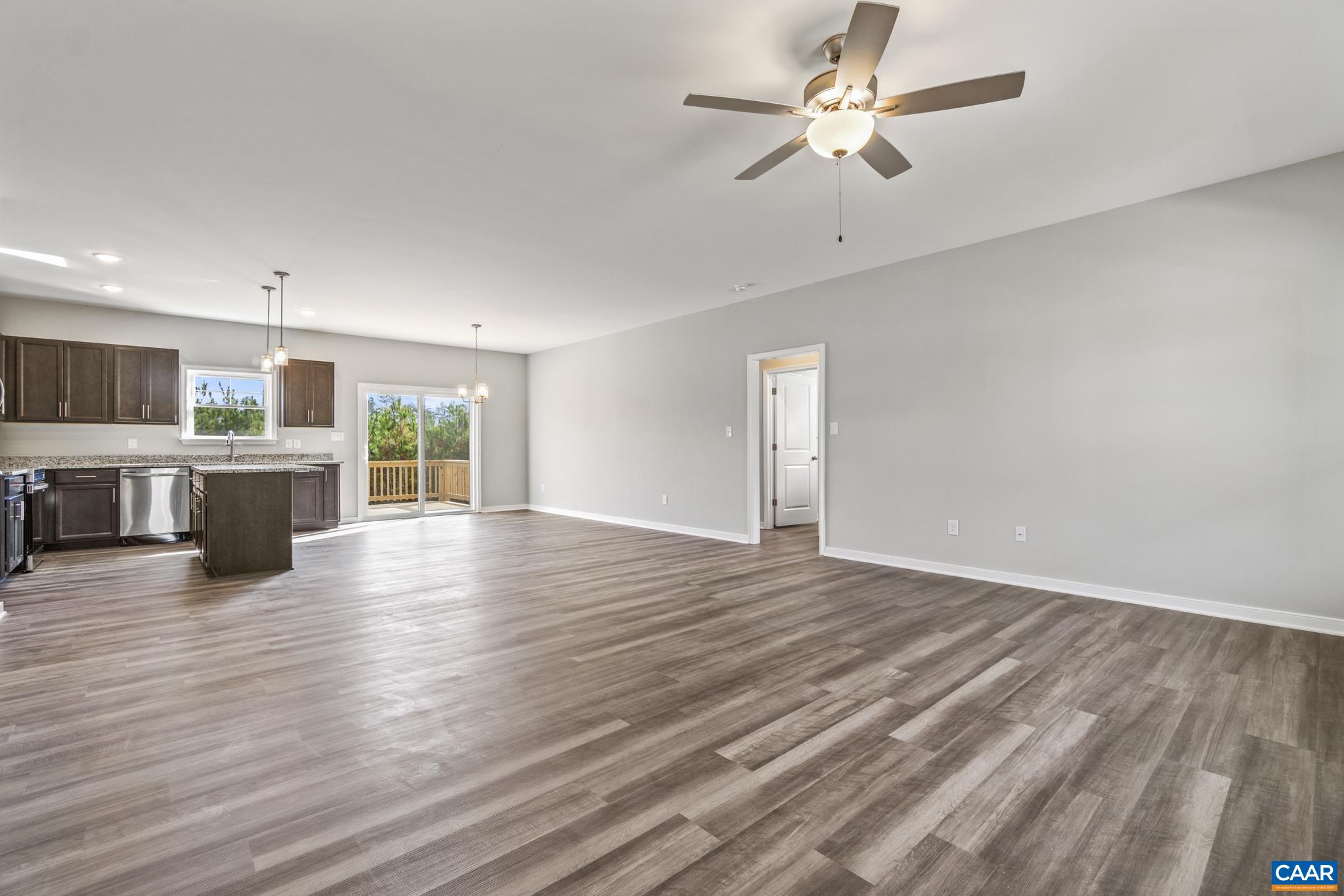 Lot 4 Hells Bend Road Palmyra, VA 22963 - Photo 5 of 21 a view of a livingroom with furniture a ceiling fan and wooden floor