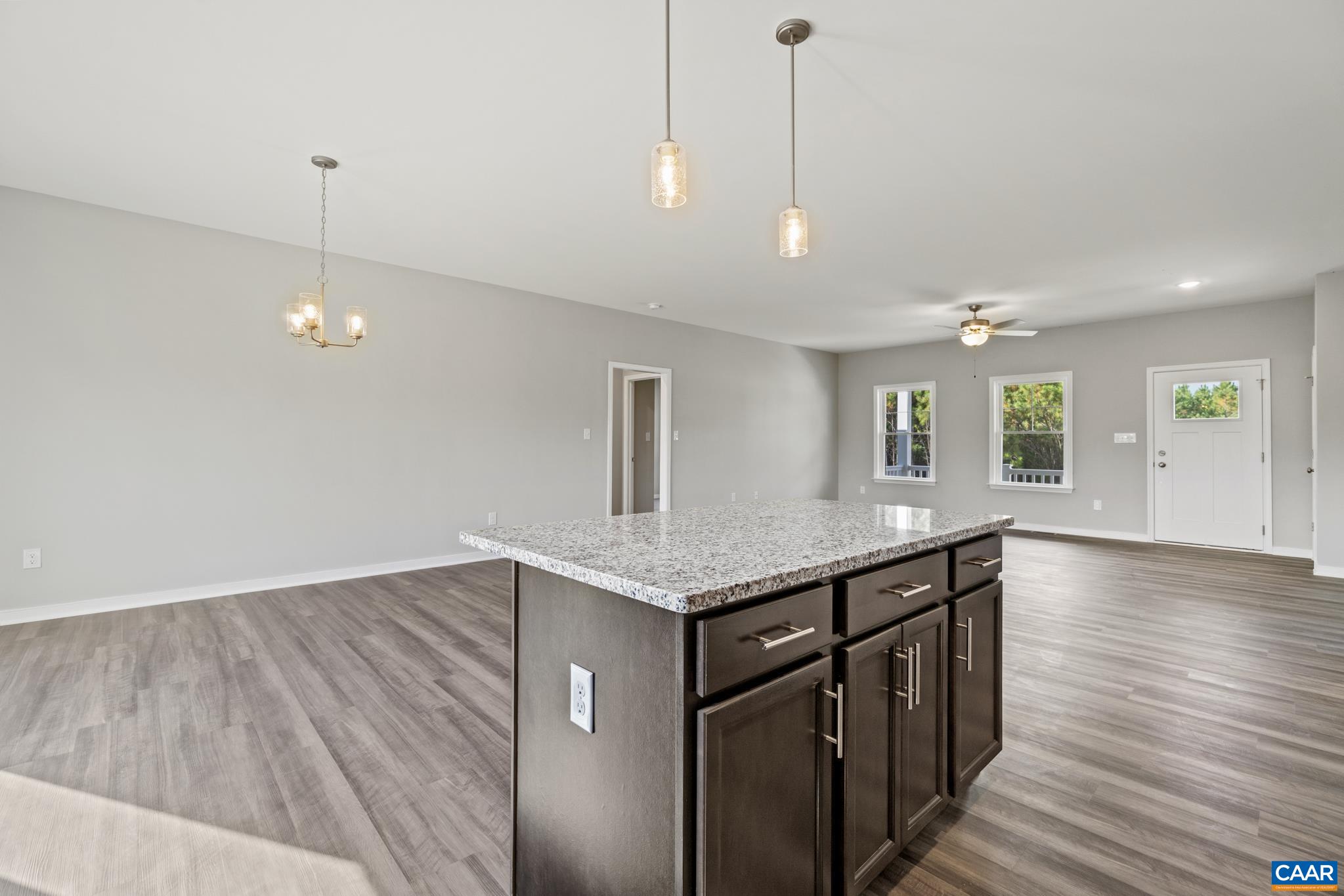 Lot 4 Hells Bend Road Palmyra, VA 22963 - Photo 8 of 21 a kitchen with a sink chandelier and wooden floor