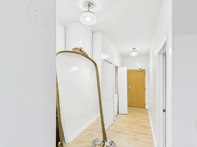 a view of entryway with wooden floor