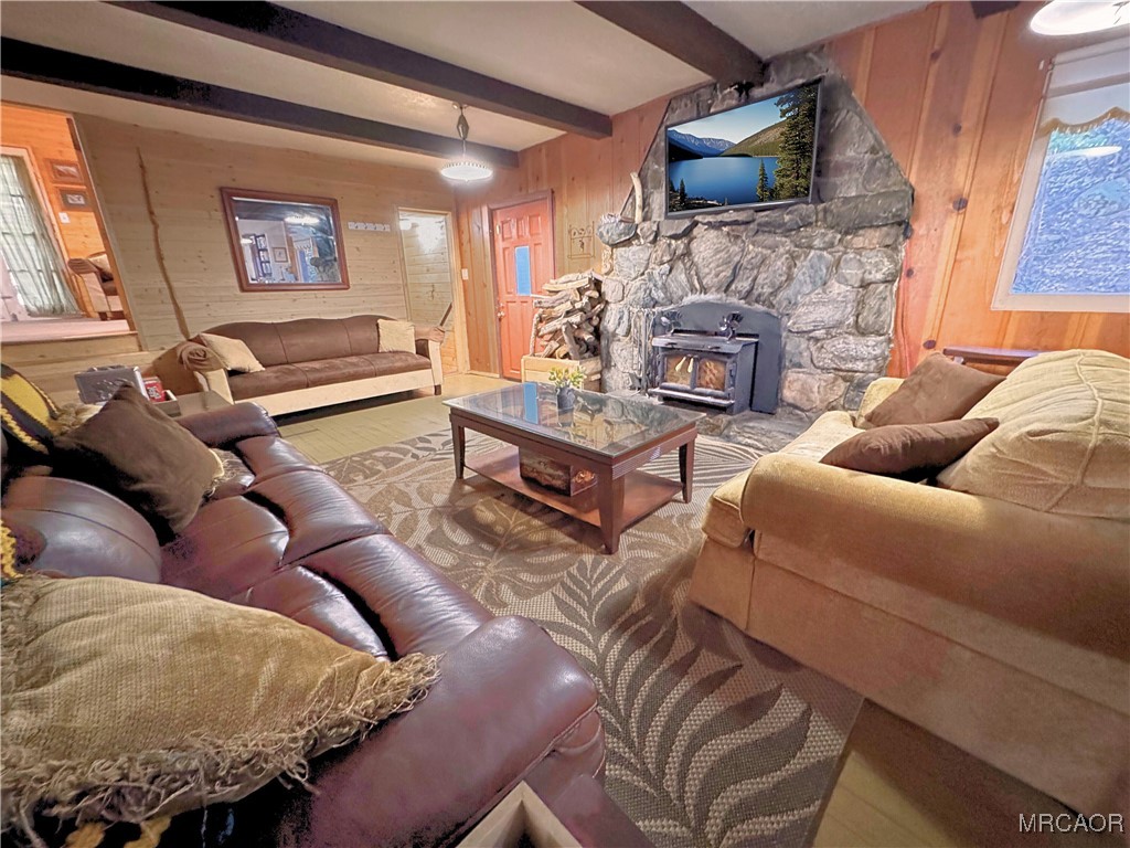 12 Barton Flats Road Angelus Oaks, CA 92305 - Photo 2 of 20 a living room with furniture and a fireplace