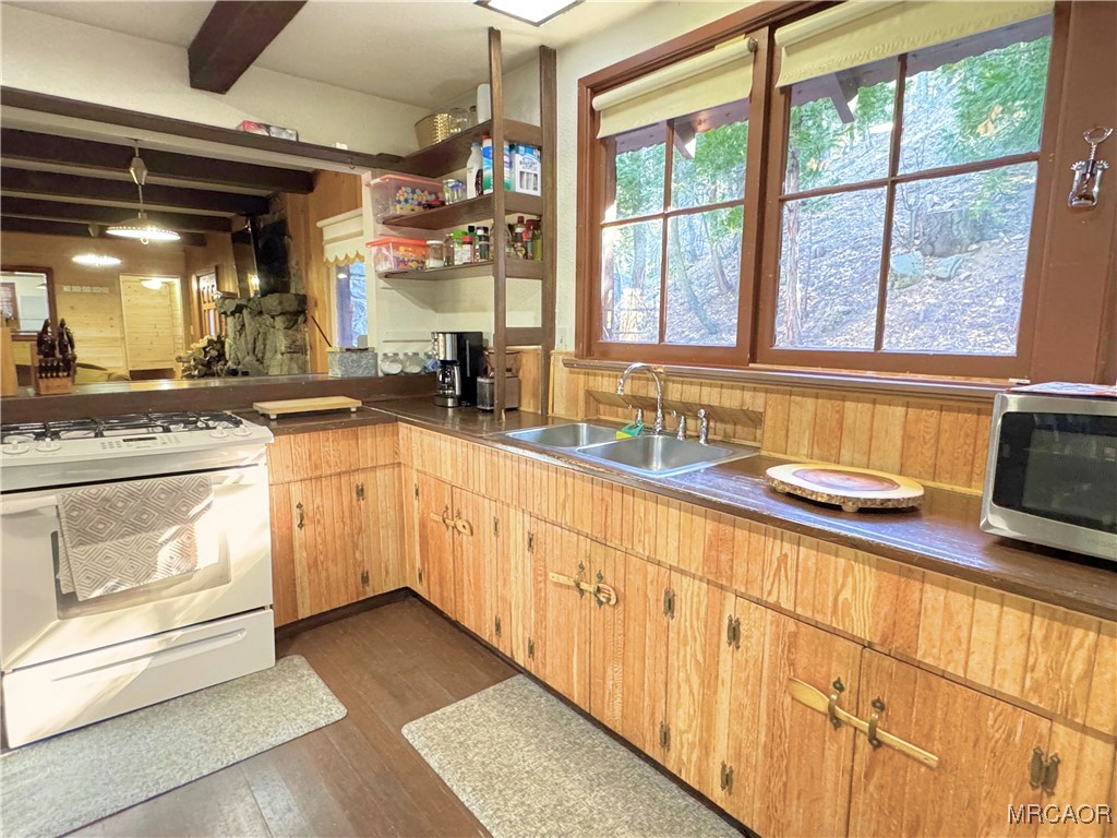 12 Barton Flats Road Angelus Oaks, CA 92305 - Photo 5 of 20 a kitchen with granite countertop a sink and white cabinets