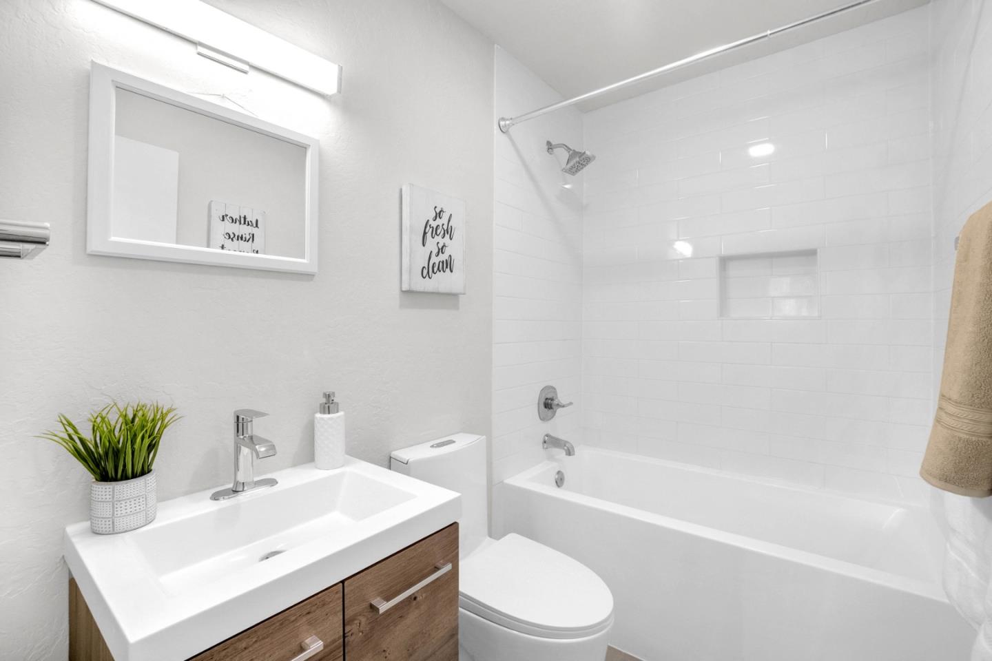 5519 Amend Road El Sobrante, CA 94803 - Photo 19 of 38 a bathroom with a sink toilet and a bathtub