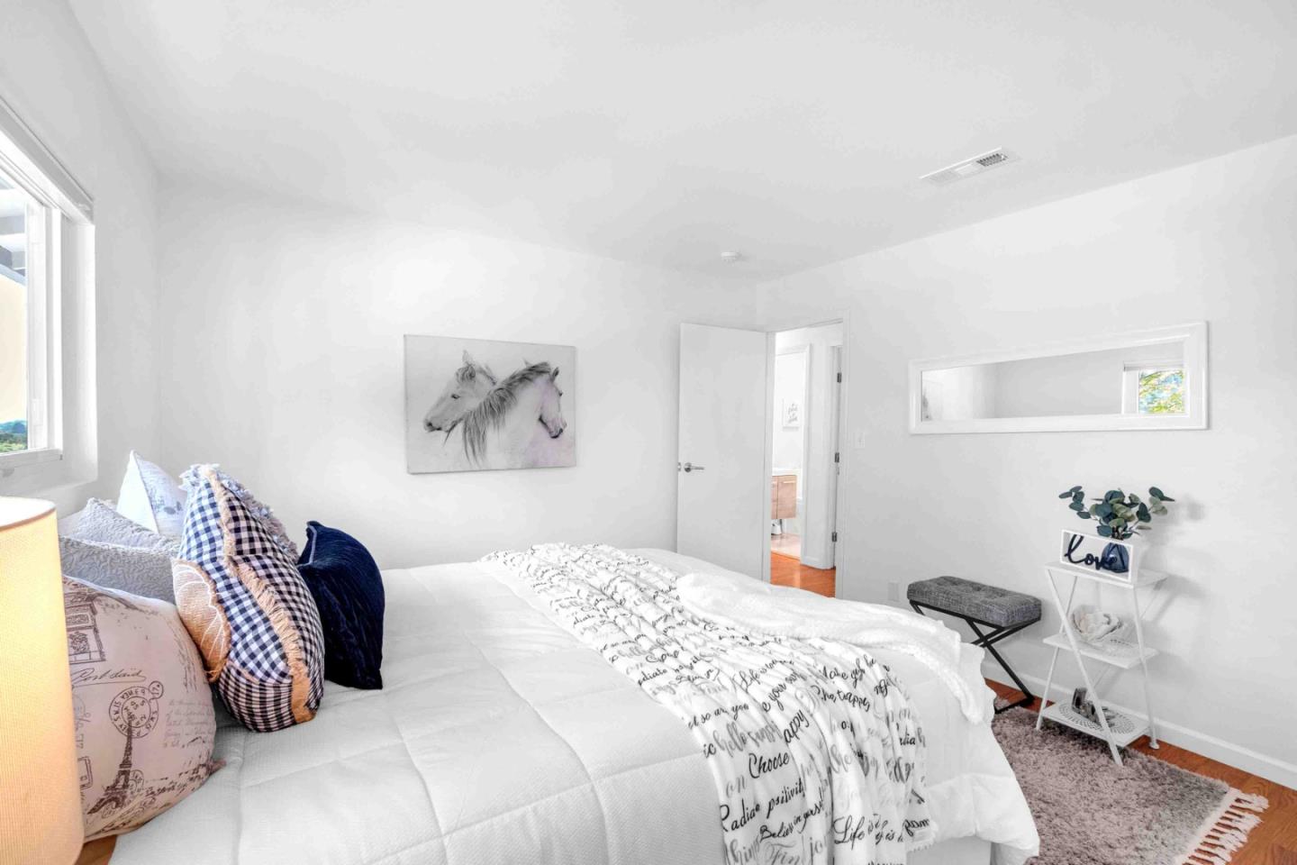 5519 Amend Road El Sobrante, CA 94803 - Photo 21 of 38 a bedroom with a large bed and a couch