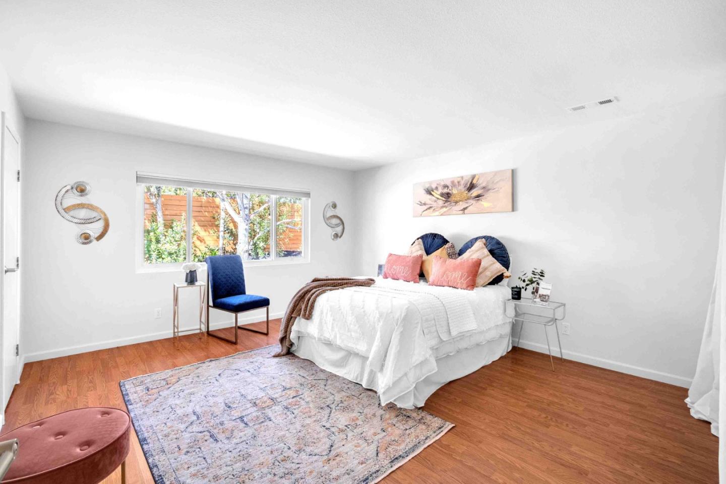 5519 Amend Road El Sobrante, CA 94803 - Photo 22 of 38 a bedroom with a bed and wooden floor