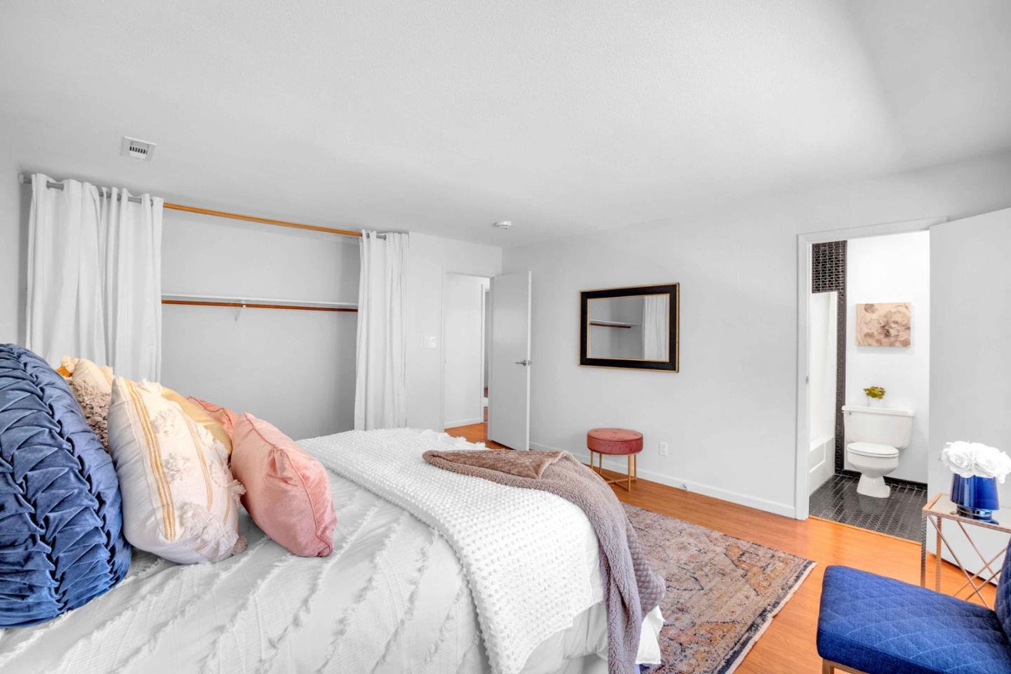 5519 Amend Road El Sobrante, CA 94803 - Photo 24 of 38 a bedroom with a bed and wooden floor