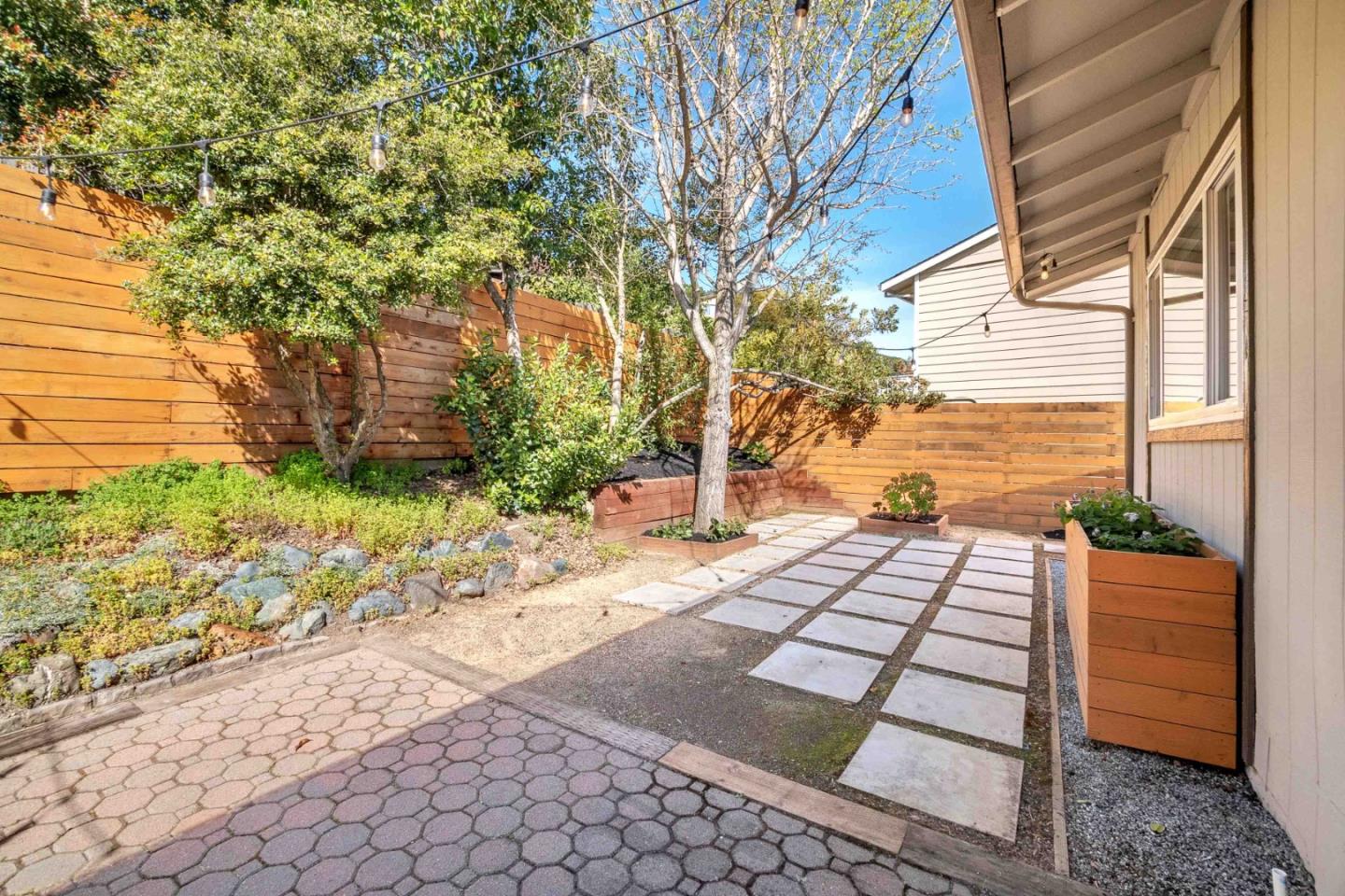 5519 Amend Road El Sobrante, CA 94803 - Photo 28 of 38 a view of a backyard with plants and large trees