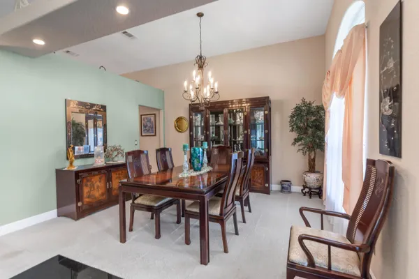 a view of a dining room with furniture and window