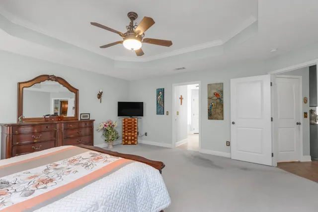 a bedroom with a bed and a dresser