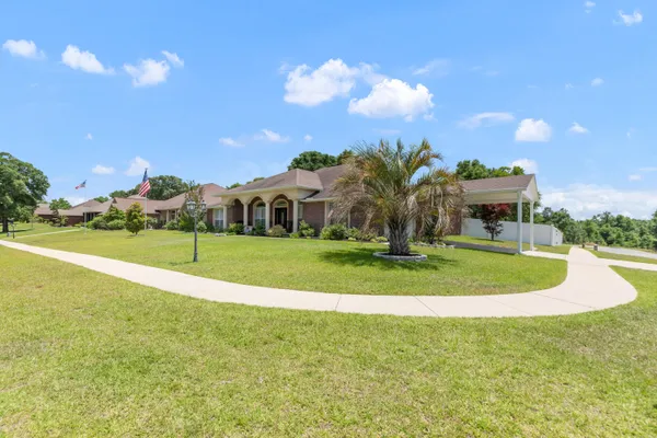 a view of a playground with basketball court