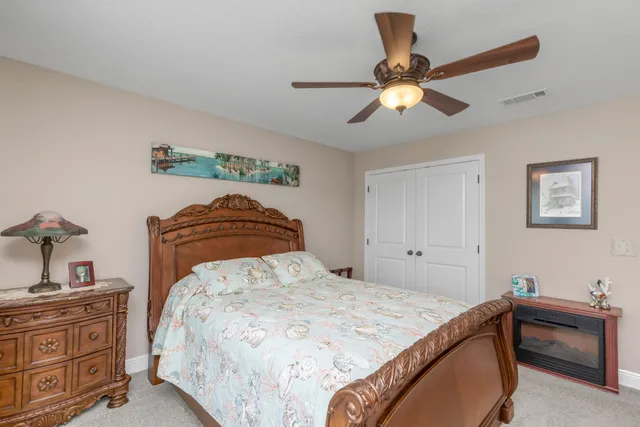 a view of a house with swimming pool and yard