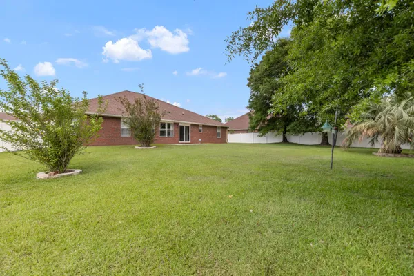 a view of a house with a big yard
