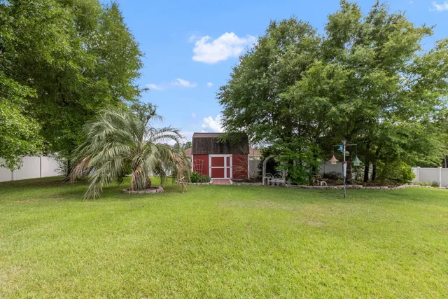 a view of a tree in front of a house
