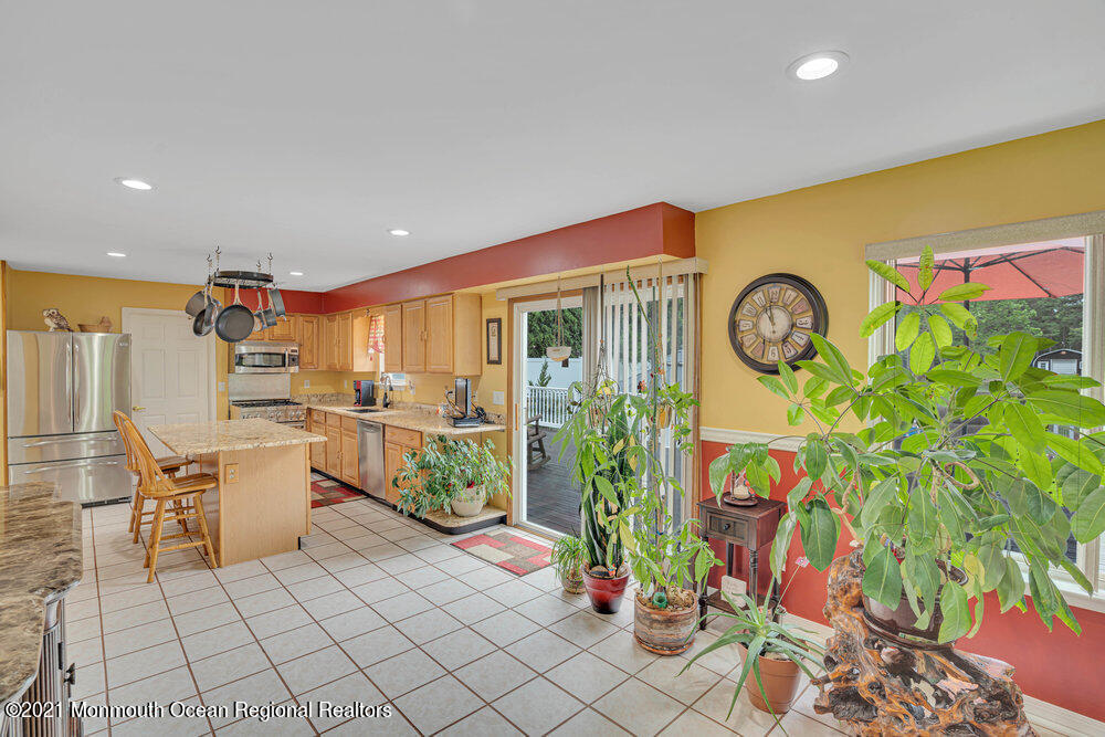 476 Cassville Road Jackson, NJ 08527 - Photo 14 of 40 a kitchen with stainless steel appliances a counter space and a view of living room