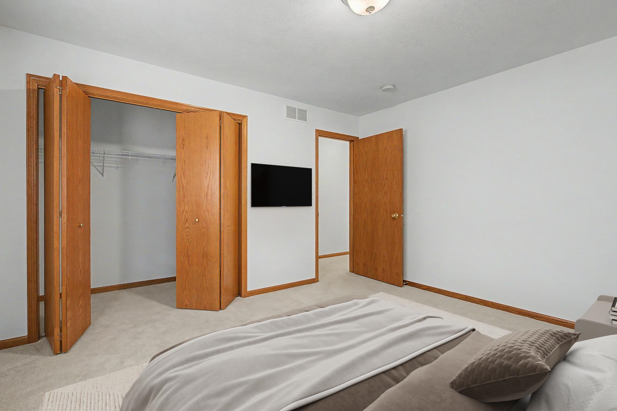 3127 Sandy Pointe Drive Freeport, IL 61032 - Photo 14 of 35 a bedroom with a bed and a wall painting