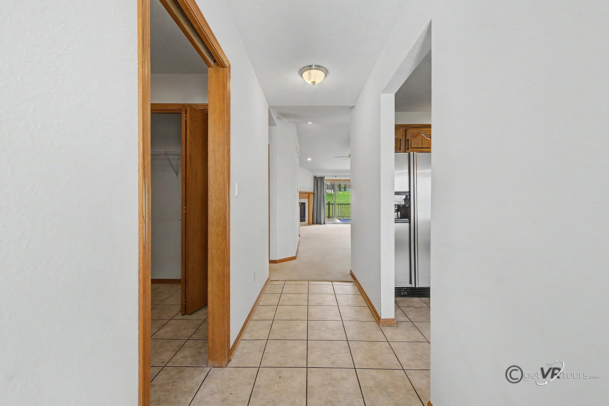3127 Sandy Pointe Drive Freeport, IL 61032 - Photo 16 of 35 a view of a hallway with a livingroom and a bathroom