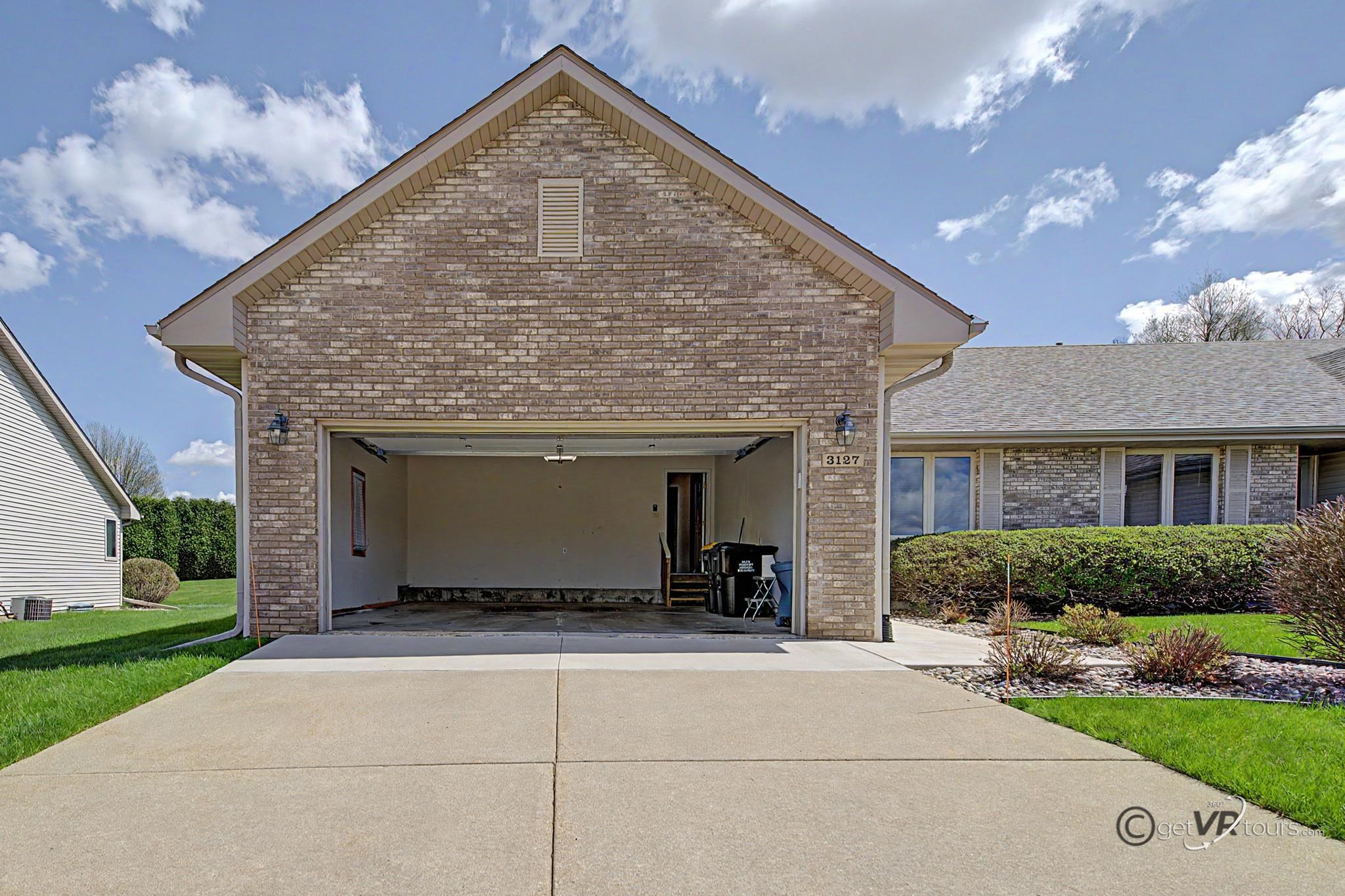 3127 Sandy Pointe Drive Freeport, IL 61032 - Photo 21 of 35 a view of an house with backyard porch and garden