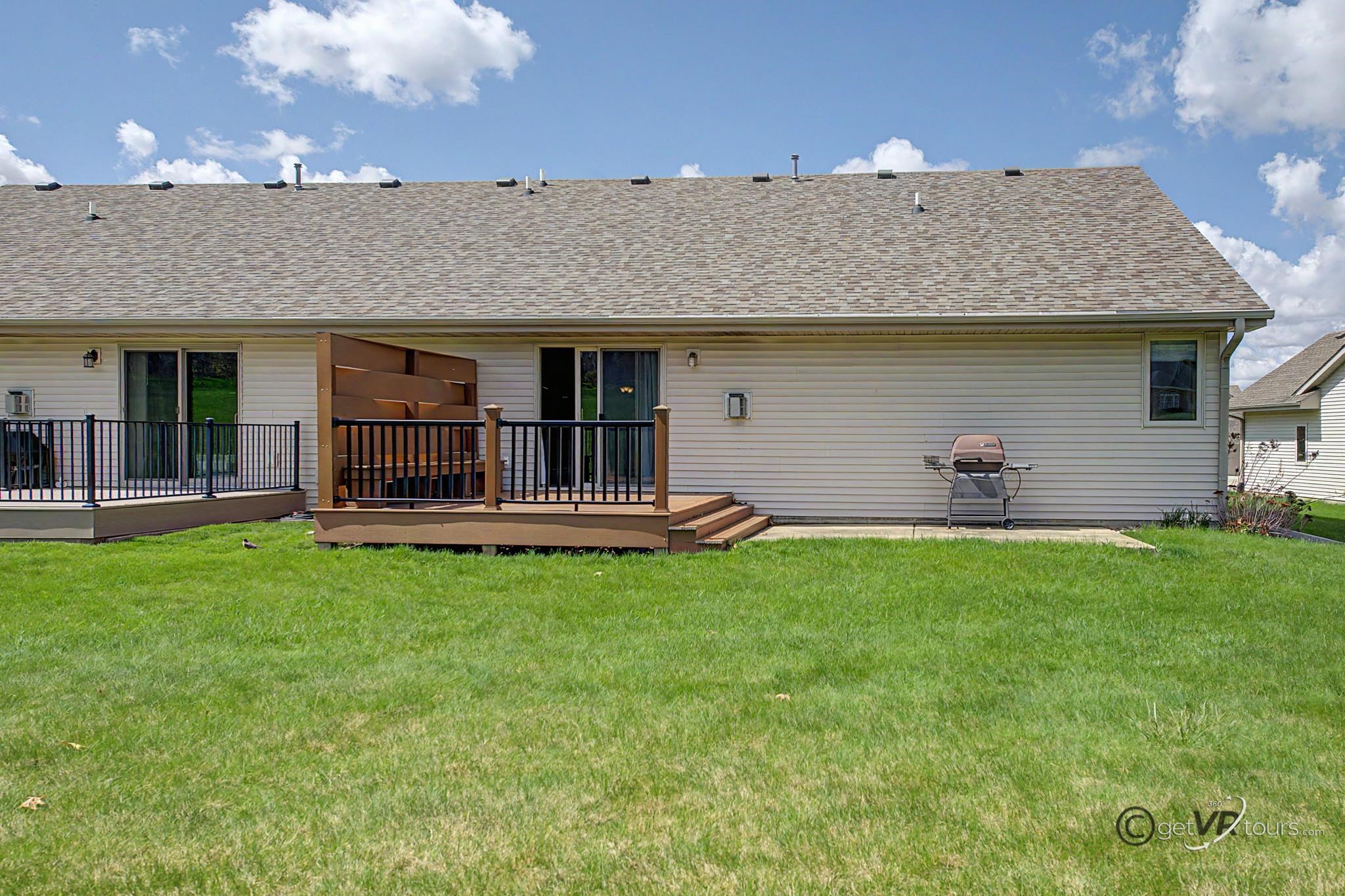 3127 Sandy Pointe Drive Freeport, IL 61032 - Photo 26 of 35 a backyard of a house with table and chairs