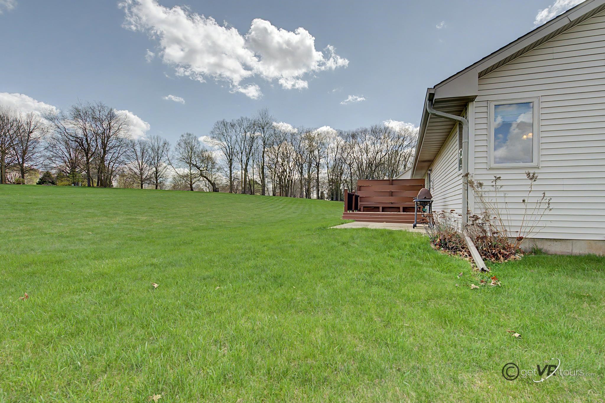 3127 Sandy Pointe Drive Freeport, IL 61032 - Photo 27 of 35 a view of a house with a big yard