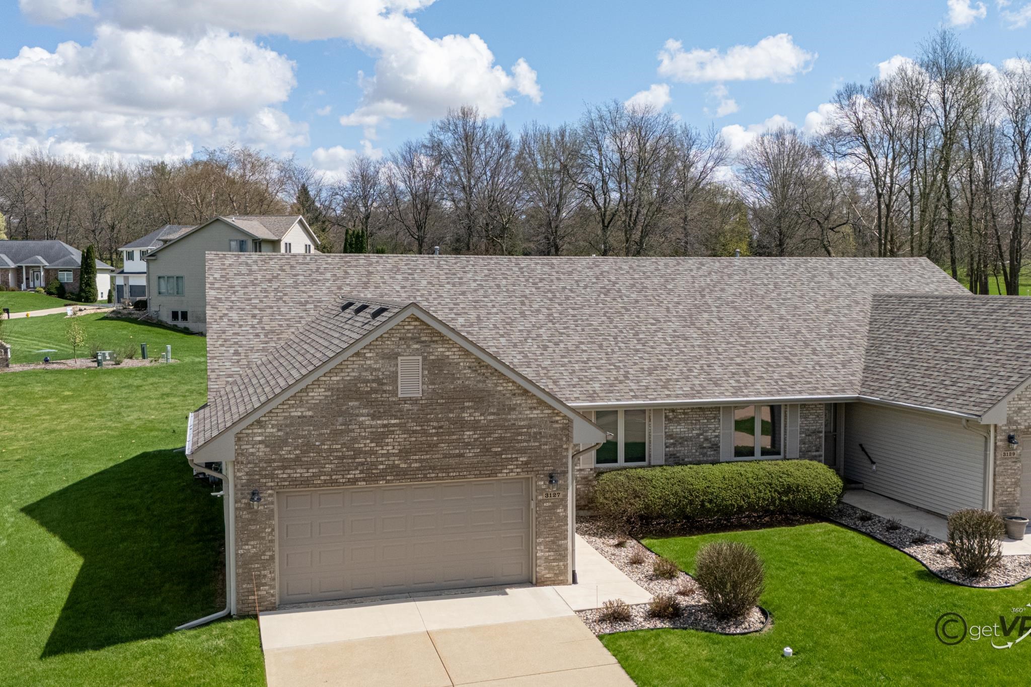 3127 Sandy Pointe Drive Freeport, IL 61032 - Photo 29 of 35 a front view of a house with garden
