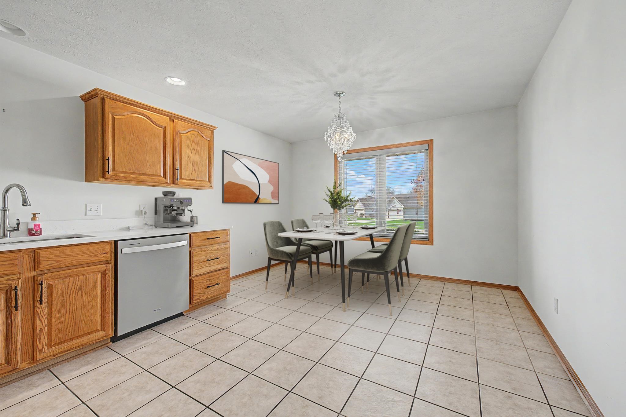3127 Sandy Pointe Drive Freeport, IL 61032 - Photo 7 of 35 a kitchen with a sink and chairs