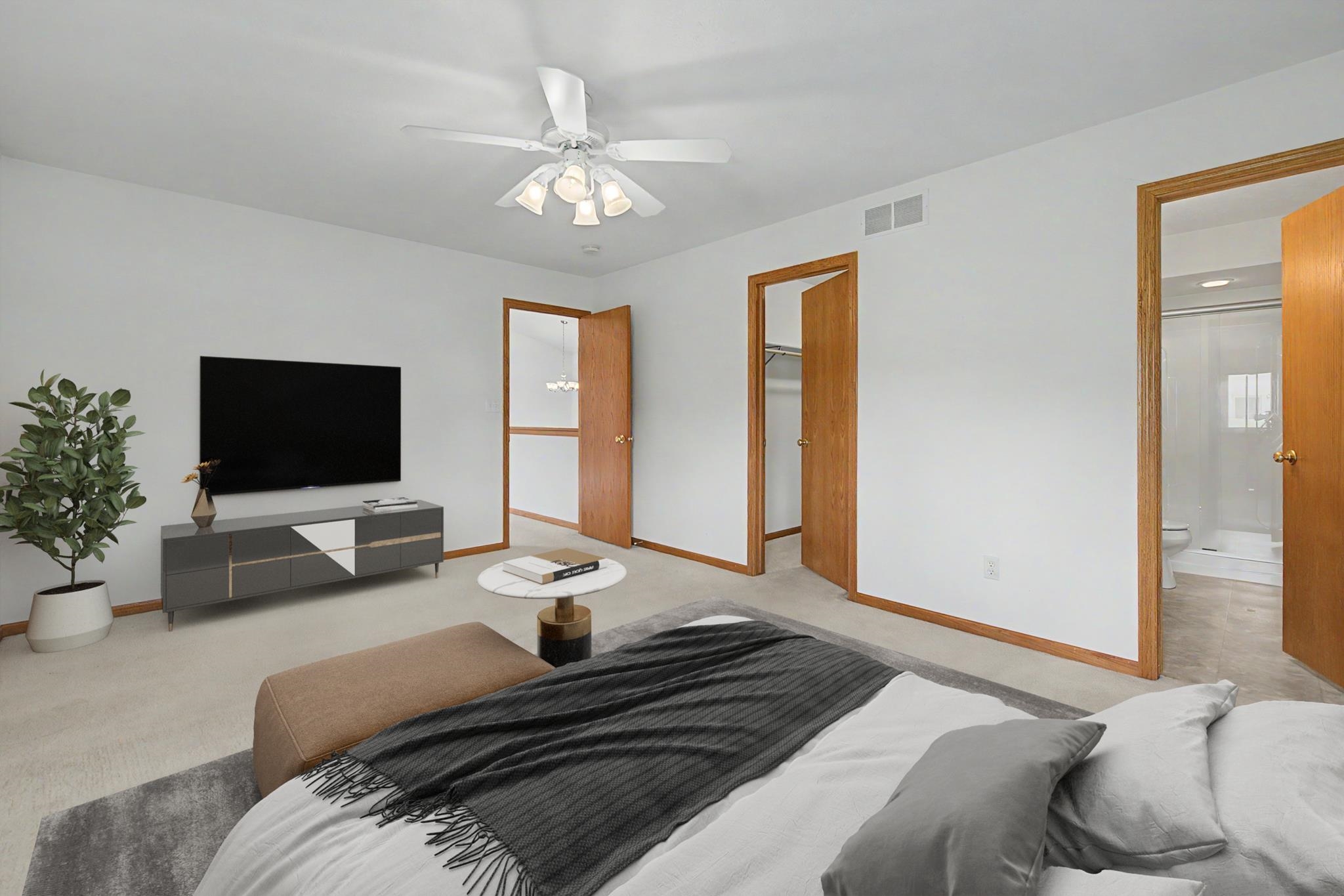 3127 Sandy Pointe Drive Freeport, IL 61032 - Photo 10 of 35 a bedroom with a bed and a chandelier
