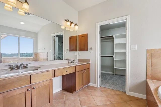 a kitchen with a sink stove and refrigerator