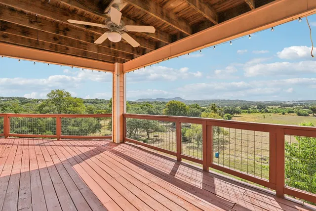 a view of balcony with wooden floor