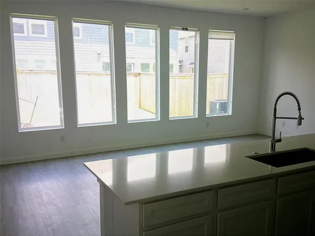 a kitchen with wooden cabinets and stainless steel appliances