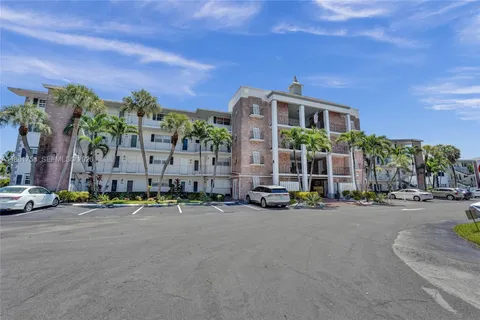 a city street lined with buildings and cars