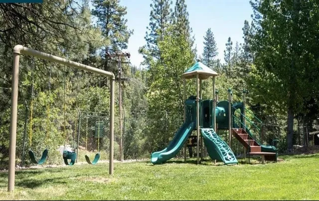 a view of a park with a slide