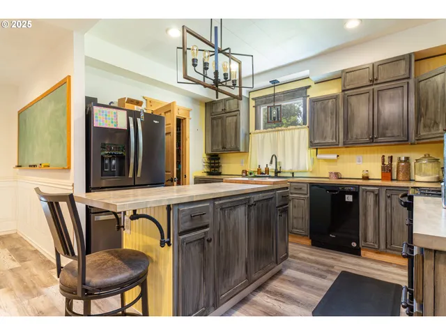 a kitchen with a refrigerator and a sink