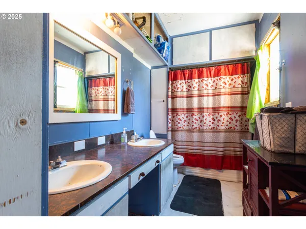 a bathroom with a sink a vanity and a mirror