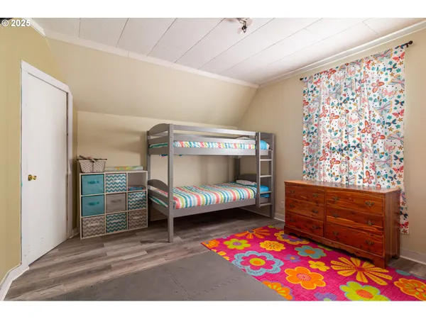 a bedroom with a bed and a dresser