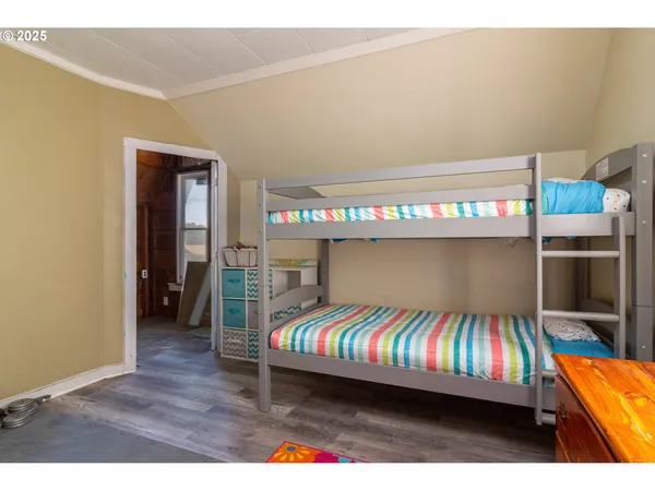 a bedroom with a bed and a table