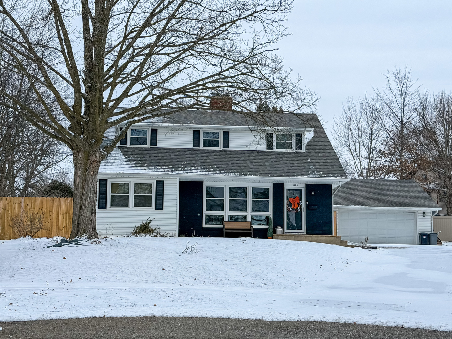 1126 West Stover Street Freeport, IL 61032 - Photo 1 of 35 a front view of a house with a yard and garage