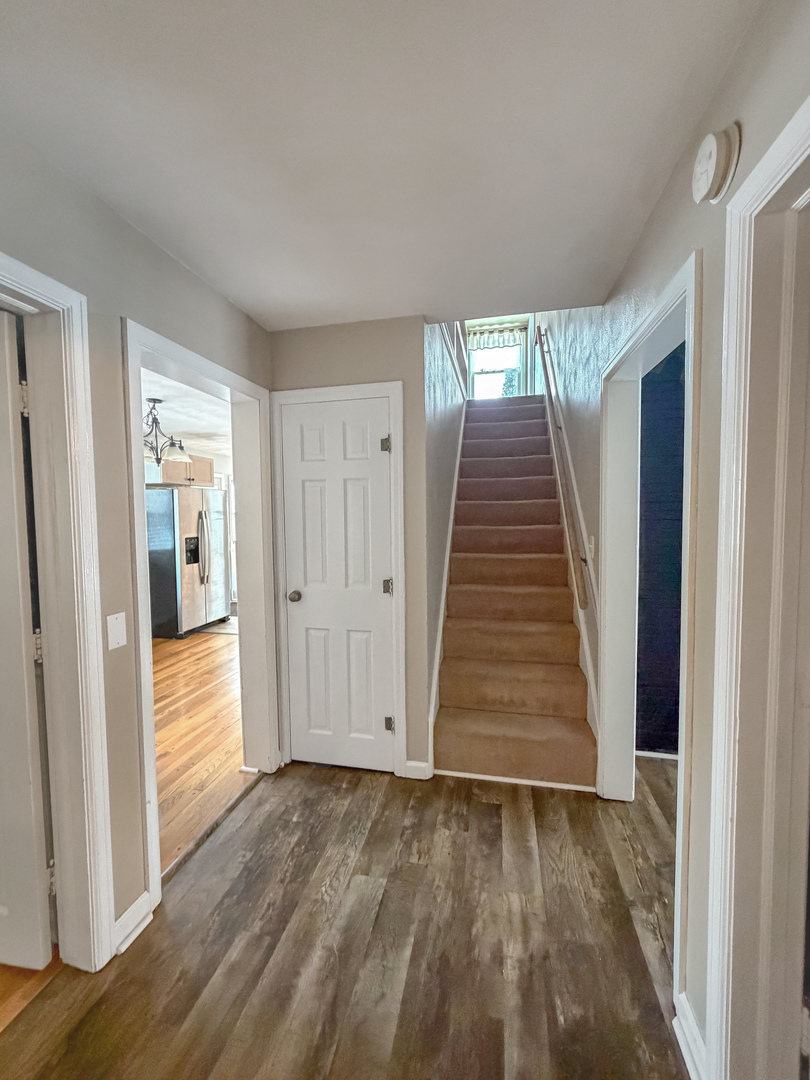 1126 West Stover Street Freeport, IL 61032 - Photo 20 of 35 wooden floor in an empty room with a window