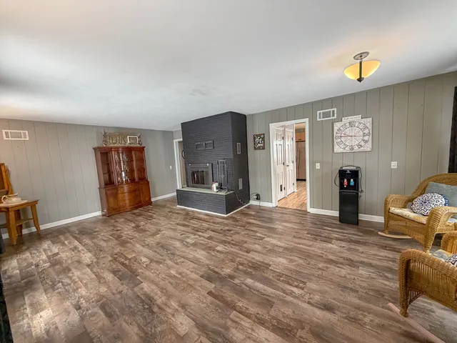 a view of a livingroom with furniture and a window