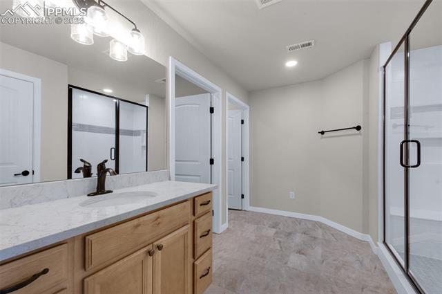 2935 Hoofprint Road Peyton, CO 80831 - Photo 9 of 10 Basement Master Suite, Large Shower with Seat