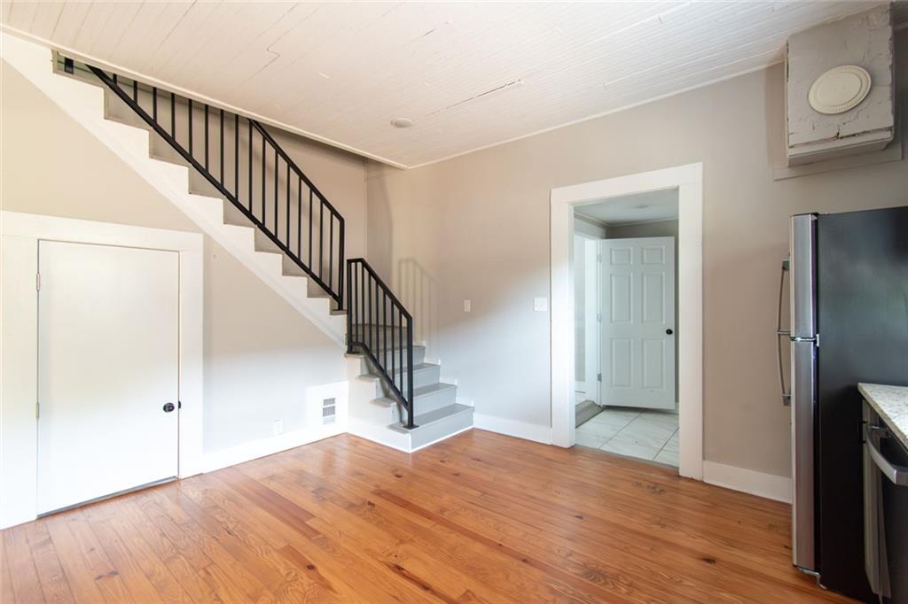 702 Radford Street Monroe, GA 30655 - Photo 30 of 49 a view of empty room with wooden floor and fan