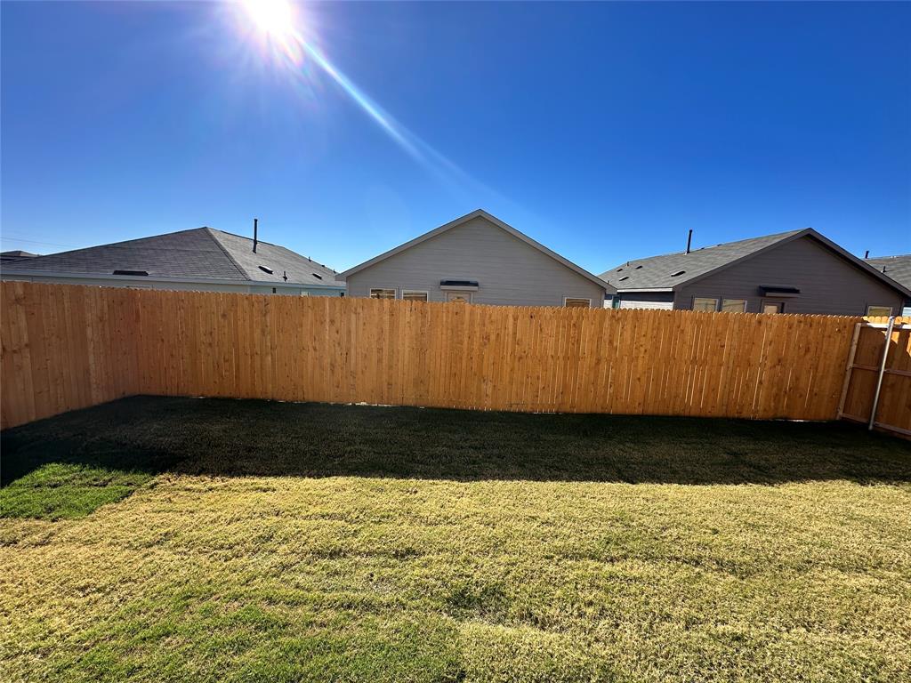 1034 Raintree Road Princeton, TX 75407 - Photo 14 of 17 a view of a house with a yard
