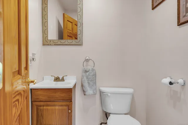 a living room with hard wood floors and a window