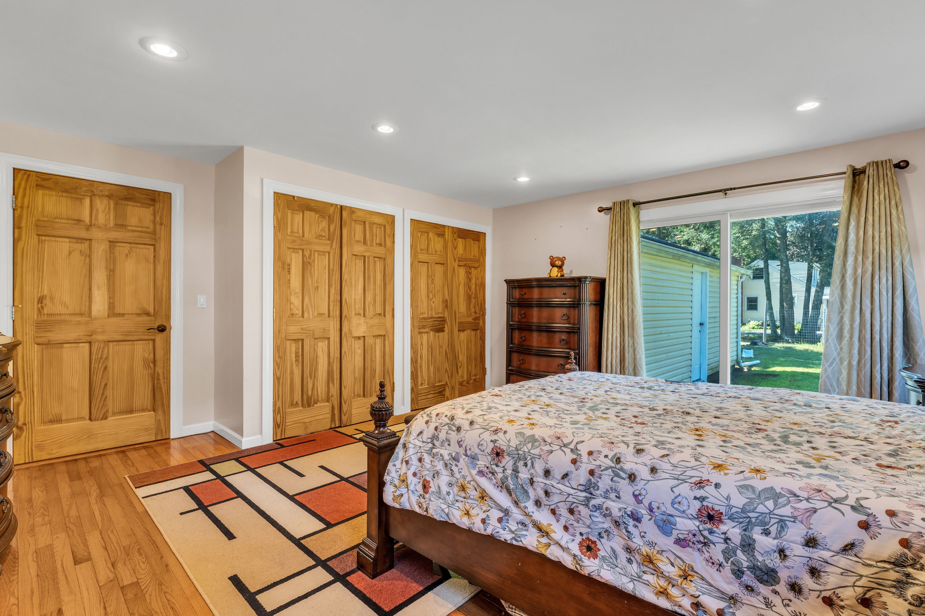 64 Dohm Avenue Guilford, CT 06437 - Photo 13 of 38 a bedroom with a large bed closet and a large window