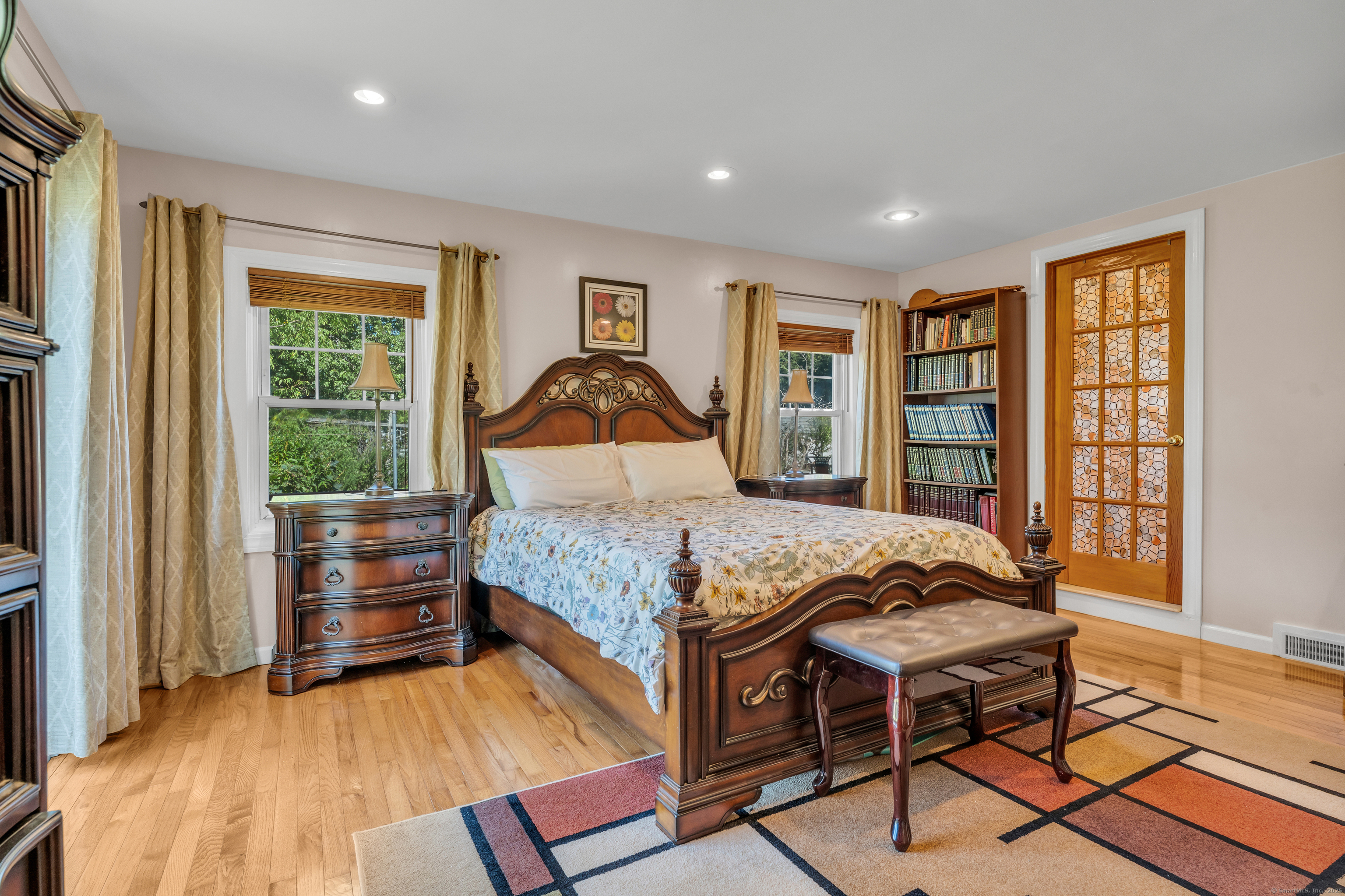 64 Dohm Avenue Guilford, CT 06437 - Photo 15 of 38 a bedroom with a bed and wooden floor