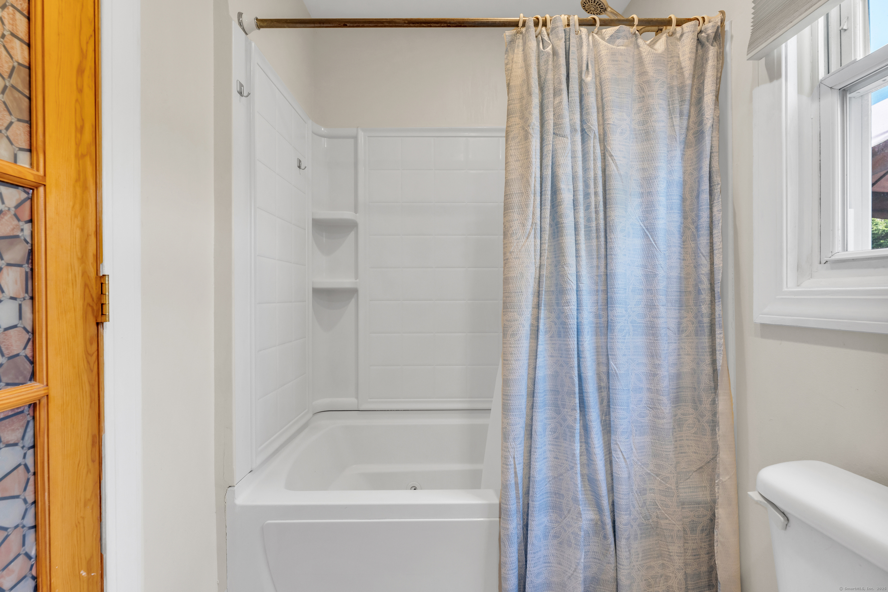 64 Dohm Avenue Guilford, CT 06437 - Photo 18 of 38 a bathroom with a shower and a toilet