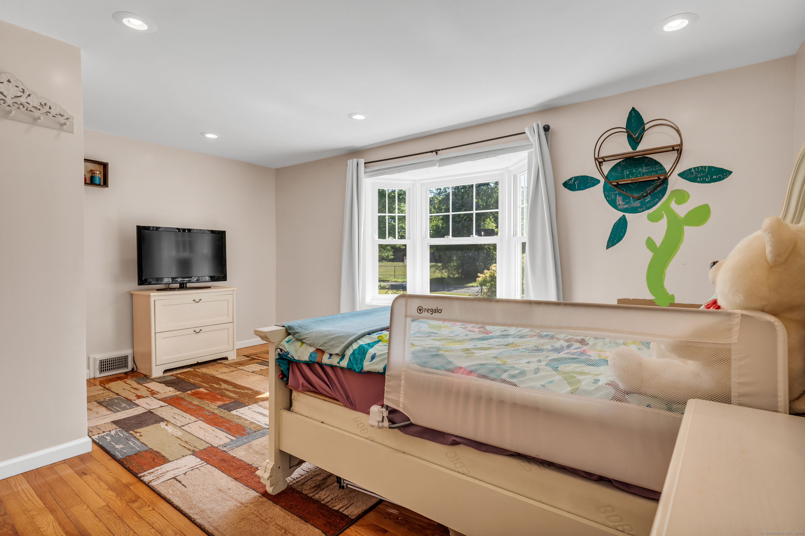 64 Dohm Avenue Guilford, CT 06437 - Photo 20 of 38 a living room with furniture and a flat screen tv