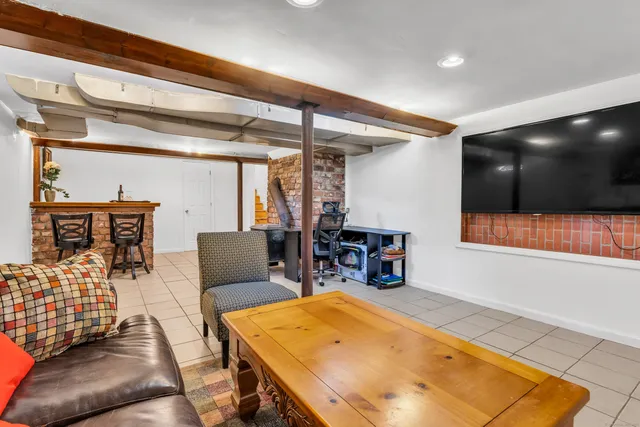 a living room with furniture and a table