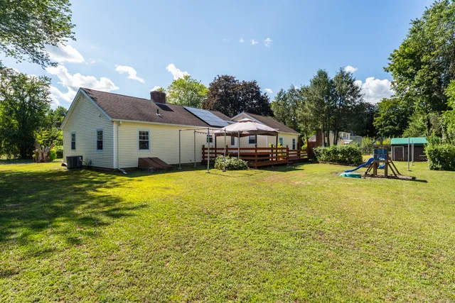 a room with furniture and a flat screen tv